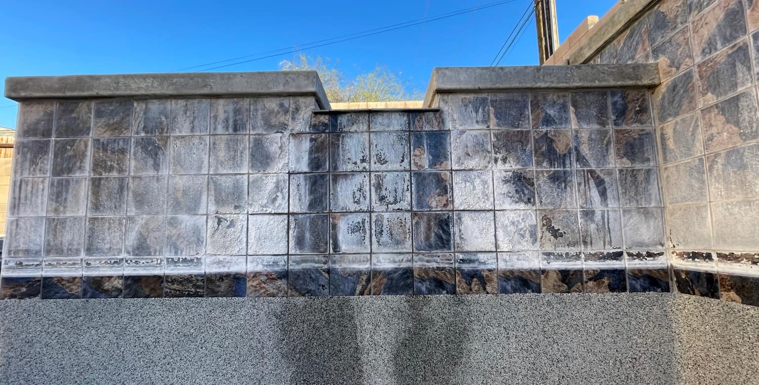 Waterline tile covered in calcium scale