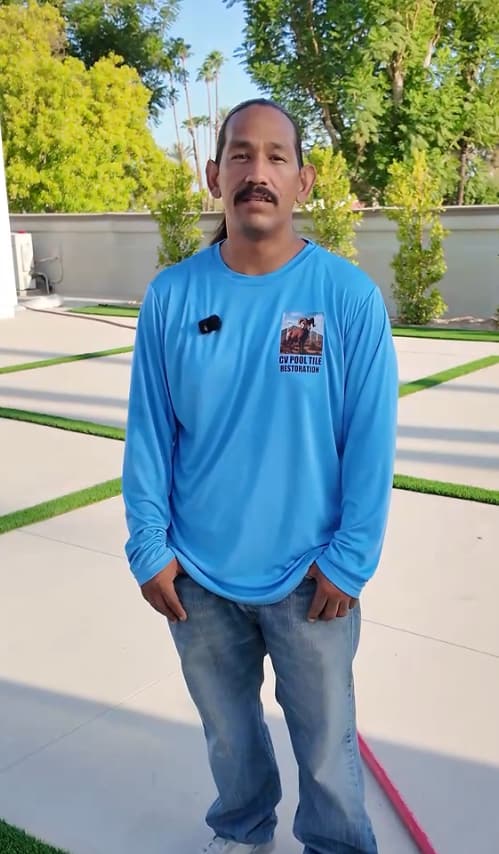 Paul Rivas, owner of CV Pool Tile Restoration, working on a pool