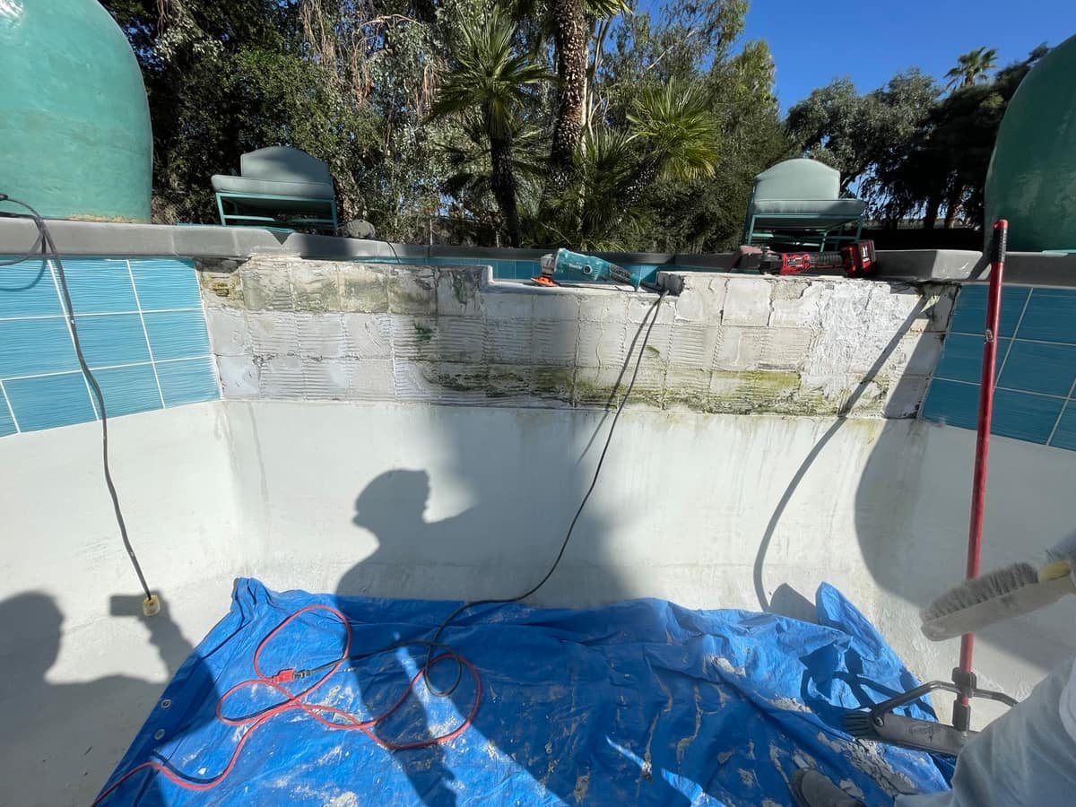 Tile repair on a raised spa wall, surface prep